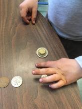 Stacking coins to flick