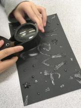 Optionally use a magnifier to look closely at the crystals