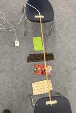 Coloured light strip hung above cloths