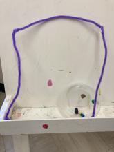 hiding amongst paint splatters