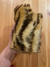 Wrap fur around a bottle of iced water