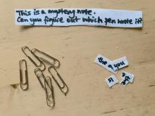 note cut into pieces