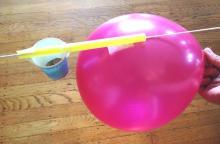 round balloon on string with weight