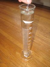 Compare modelling clay shapes in a cylinder of water
