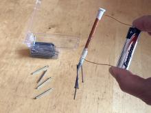 Picking up small nails with electromagnet