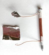 Wrap tin foil over folded mag wire ends