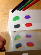 Marker pen colours through scratched plastic