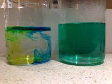 A few minutes after adding yellow and blue food dye to cold water (left) and warm water (right)