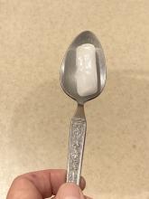 Dry ice in a spoon vibrates as gas escapes under it