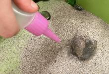 move a rock only by blowing sand from around it