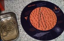 Board with nails and elastic bands