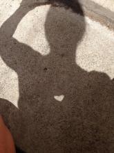 Heart cut out of a post it note and stuck on the mirror, using the sun