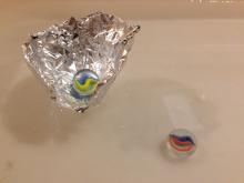 Shape tin foil to hold a sinker afloat