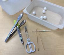 tongs and chopsticks with foam balls to move around