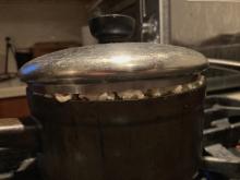 Popcorn filling a pan pushes a lid up!