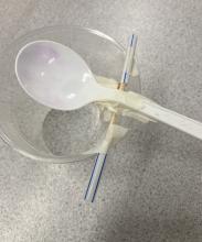 two straws stop the spoon from sliding sideways