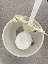 tape allows rotation and springs the spoon back