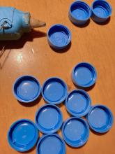Hot glue in lids prevents cracking