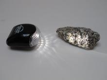 A bike light shows the sparkly crystals in granite