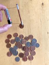 Pick up coins containing nickel with electromagnet