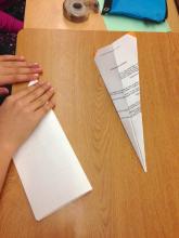 Folding paper to make a plane