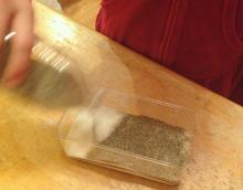 Shake layers of sugar and sand alternately into the tray