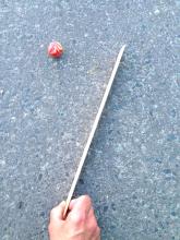 hit at the top of the stick