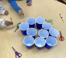 jumping stick game: get it in a cup
