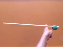 Adding weight to one end of the stick changes the balance point