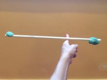 Adding weight to both ends of the stick changes the balance point
