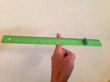 New balance point of a ruler with weight