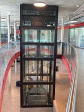 elevator pulley is hidden above the passenger car